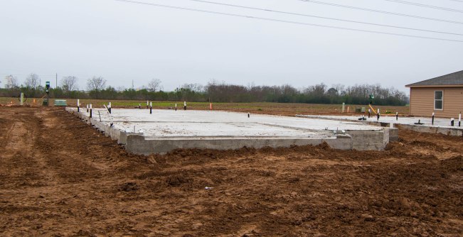 You can see the corner of the first house